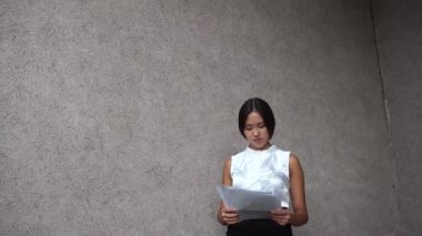 Young Beautiful Business Woman Female Girl Portrait Hold Documents on Background Office Building Outdoor