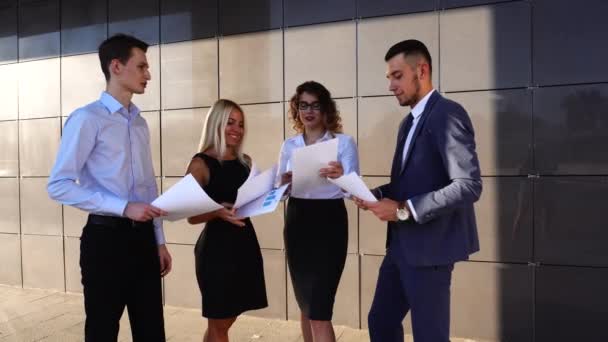 Business Team Standing Near Center Office With Documents — Stock Video