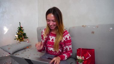Young Girl Portrait Smile Talk on Smart Laptop Skype on Christmas Tree Bokeh Xmas Eve Lights New Year Confetti Background at Home