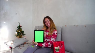 Young Girl Portrait Smile Show Point Green Screen Tablet Christmas Tree Bokeh Xmas Eve Lights New Year Confetti at Home