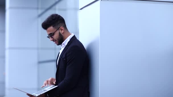 Cool Guy Arabic Man Uses Laptop in Business Center — Stock Video