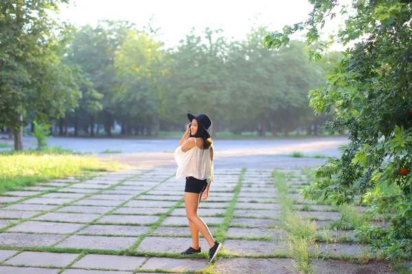 Wonderful female hat asian sunset cheerful emotions laughter dancing — Stock Photo, Image