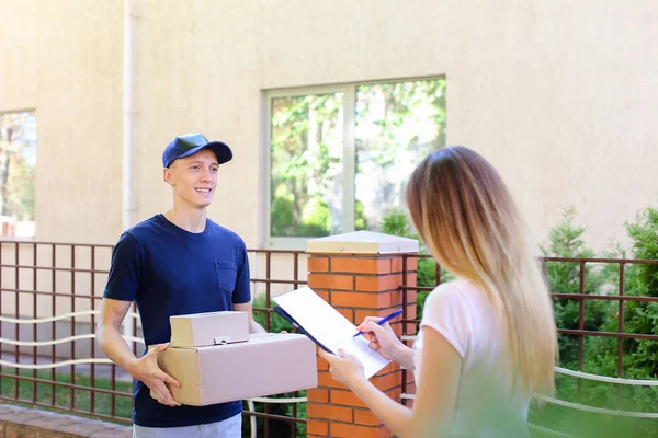 Postman Giving Pen And Documents to Girl, Woman Puts Signature a