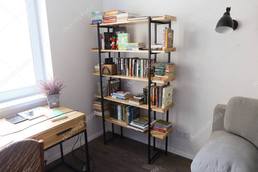 Bookcase in furnished office for work or leisure in spacious roo