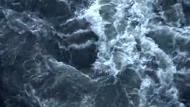 Water from waterfall creates white and strong waves. — Stock Video