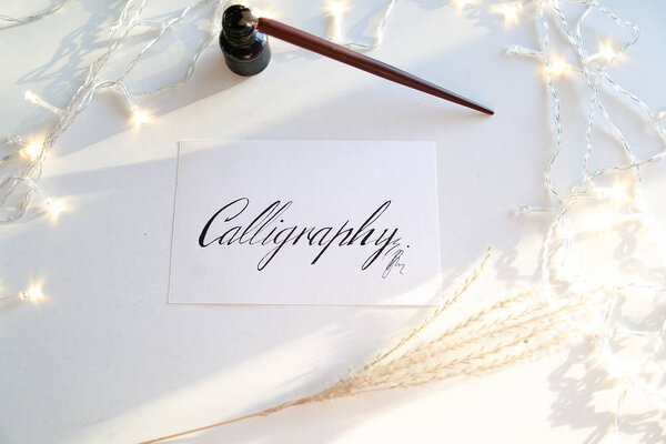 Beautiful postcard with calligraphic inscription of black ink on