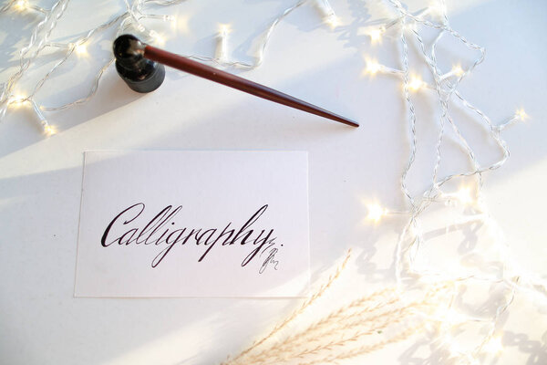 Beautiful postcard with calligraphic inscription of black ink on