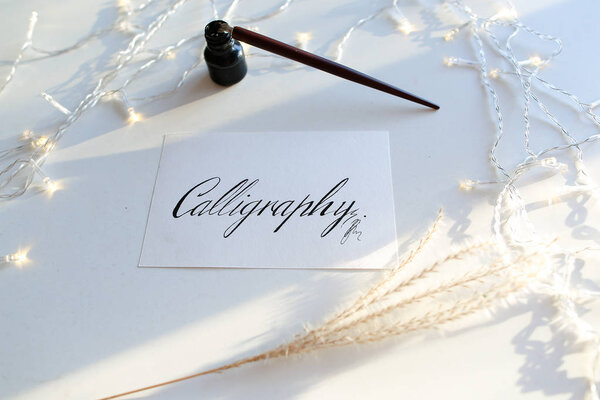 Beautiful postcard with calligraphic inscription of black ink on