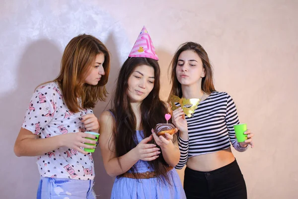 Lovely friendly girls celebrate birthday of their female friends — Stock Photo, Image