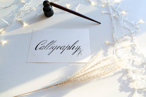 Beautiful postcard with calligraphic inscription of black ink on