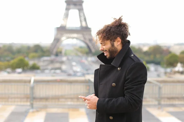 Arabian groom talking on smartphone near Eifel Tower in slow mot — Stock Photo, Image