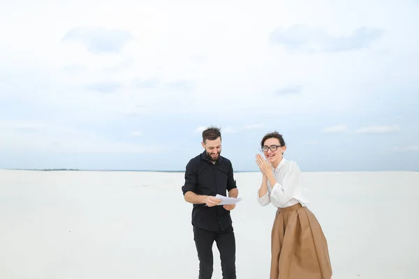 Student male agree with business woman on buying plot of land