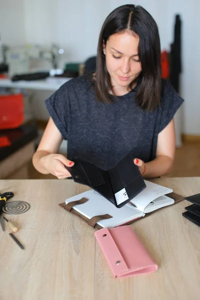 young designer making women bags for sale.