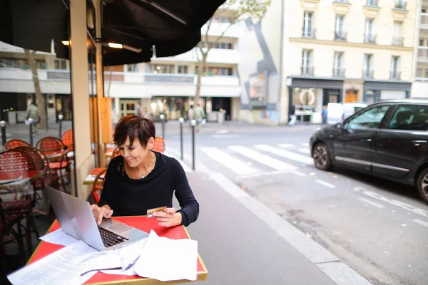 female client of co-working center make purchases by credit