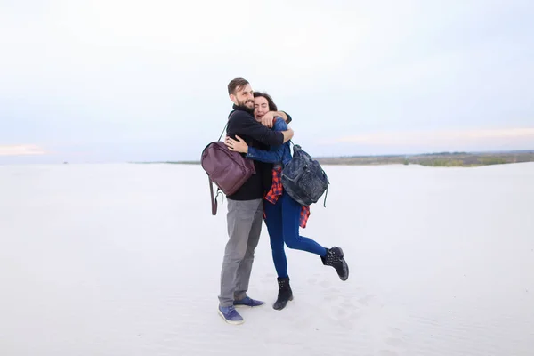 Presenters of travel program married couple viewing map.