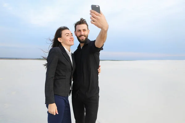 boyfriend and girlfriend testing front-camera in new smartph