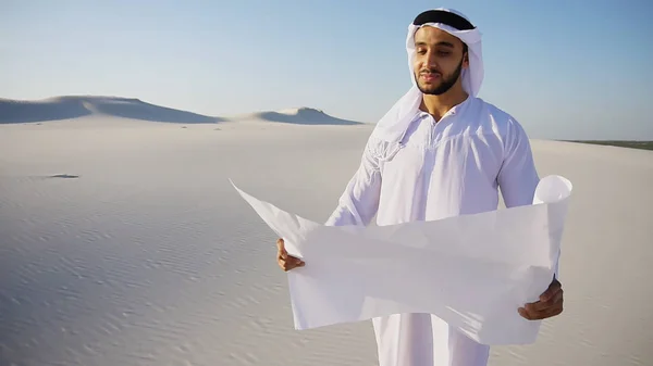 Serious young Arabian UAE Sheikh businessman considering constru