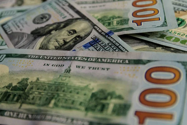 Background with money american dollar bills. Hundred dollar bills close-up.