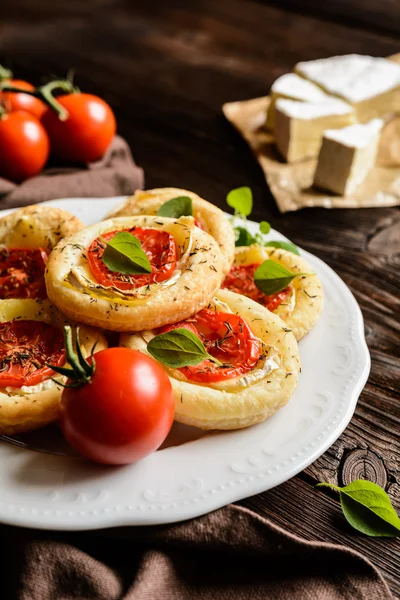 Mini pizzas with Camembert and tomato — Stock Photo, Image