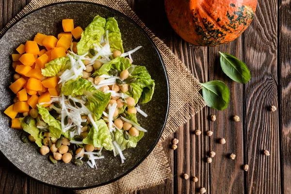 Pumpkin salad with chickpeas, radish, lettuce and seeds — Stock Photo, Image