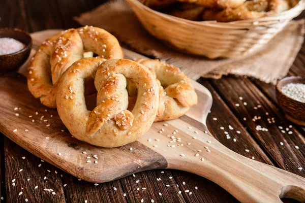 Whole meal pretzels with sesame and salt — Stock Photo, Image