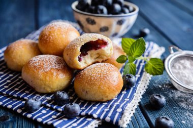 Baked blueberry buns clipart
