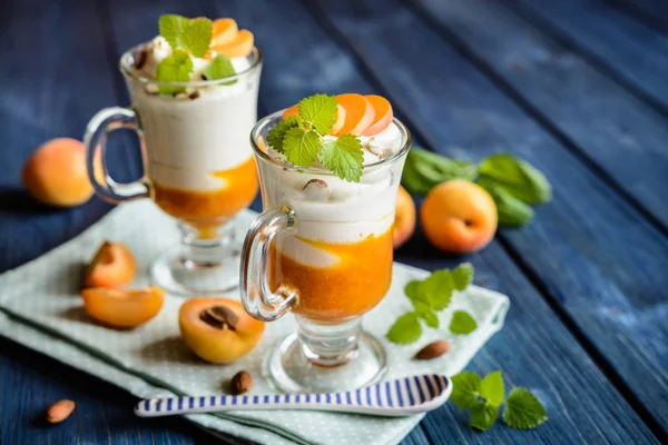 Layered apricot and cream cheese dessert — Stock Photo, Image