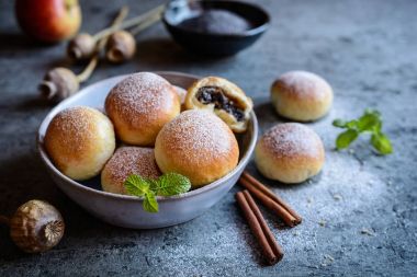 Homemade buns filled with poppy seeds and apple clipart