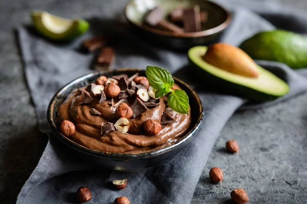 Raw avocado chocolate mousse with hazelnuts — Stock Photo, Image