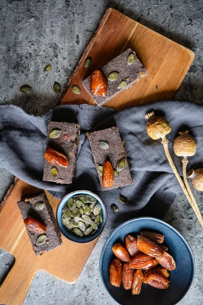 Poppy seed energy bars with dried apricot, dates, pumpkin seeds, buckwheat and honey