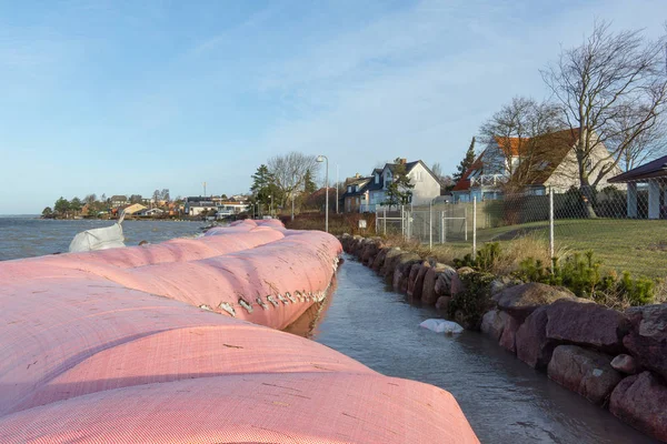 Pink water tube against the storm Urd in Frederikssund, Denmark