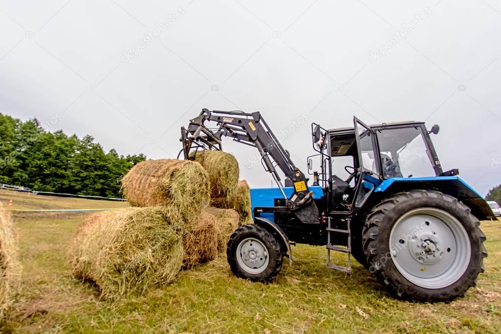 tractor hay stacks in the field. Toning