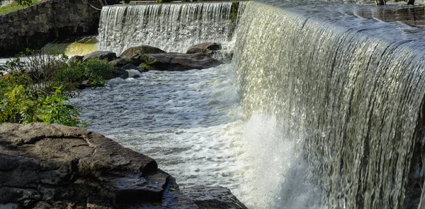 Artificial low waterfall with stones — Stock Photo, Image