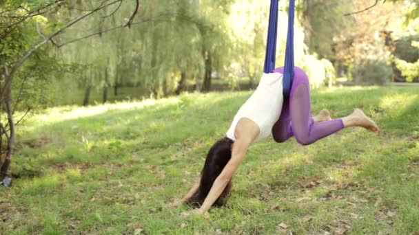 Practice of anti gravity fly yoga with hammock — Stock Video