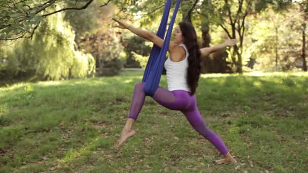 Practice of anti gravity fly yoga with hammock — Stock Video