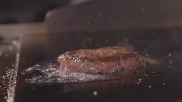 Street food restaurant, close-up grilling burgers cutlet on the frying surface. — Stock Video