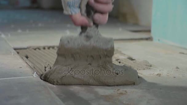 Professional worker laying tiles on floor — Stock Video