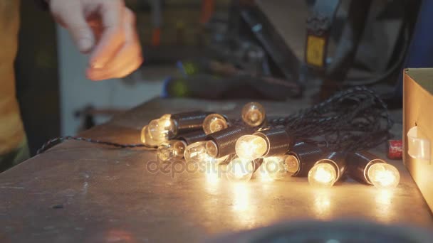 Man preparing lights for decorating house for christmas holidays, closeup — Stock Video