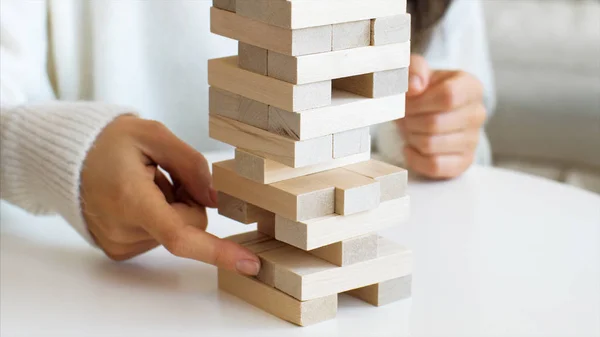 Playing in wooden tower at home, close-up