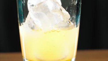 Barman is making alcohol cocktail, close-up
