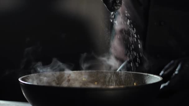 Chef cooking in wok pan at commercial kitchen — Stock Video