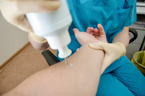 Detail of male using ultrasound probe on senior males wrist — Stock Photo, Image