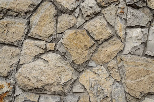 Seamless texture stone wall. Natural seamless background. Stone wall of river stone