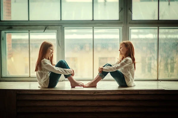 Redhead sisters in loft interior — Stock Photo, Image