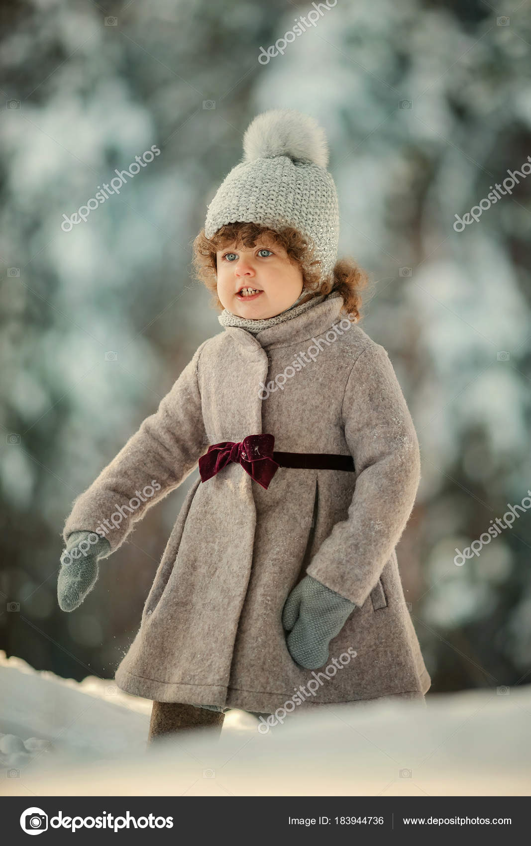 Cute Smiling Little Girl Short Curly Hair Posing Woolen Hat