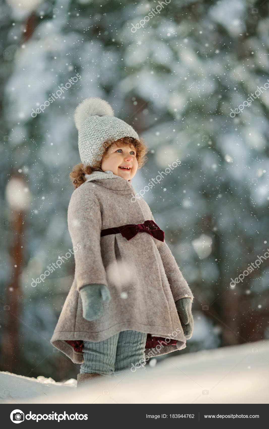 Cute Smiling Little Girl Short Curly Hair Posing Woolen Hat