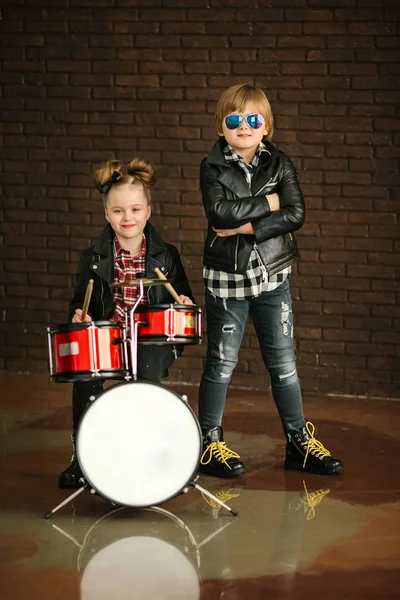 Little Pretty Girl Nice Boy Leather Jackets Toy Drums Brick Royalty Free Stock Images