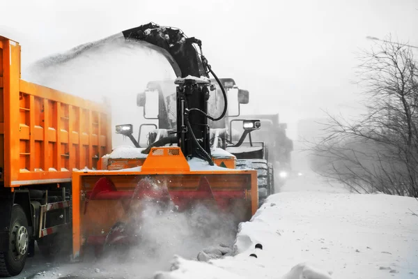 Norilsk, Russia - March 23, 2020: Snow plow removing snow from city road. — Stock Photo, Image