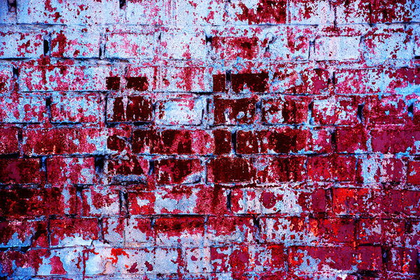 Brick wall painted with acrylic multicolored paint surface for background. Brick wall. Different colour. Close-up. Old wall multicolor. Bricks painted in a different bright color