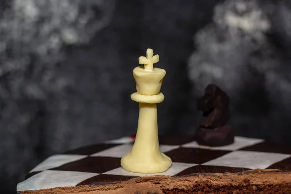 Brown cake with chocolate bisquit and chess piece — Stock Photo, Image